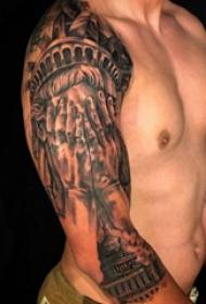 手臂纹身素材 男生手臂上建筑物和人物纹身图片