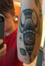 Arm tattoo picture boy's arm on black rocket tattoo picture