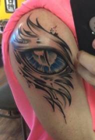 Tatuatge d'ulls, braç de noi, imatge de tatuatge d'ulls dimoni