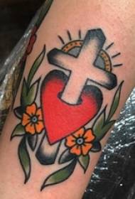 Tatuatge de braç de nen de creu petita a la imatge de la flor i la creu del tatuatge