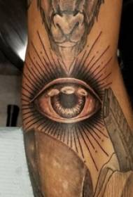 Eye tattoo, boy's arm, black gray eye tattoo picture
