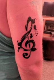 संगीत नोट टैटू लड़की की बांह ऊपरी नोट टैटू तस्वीर