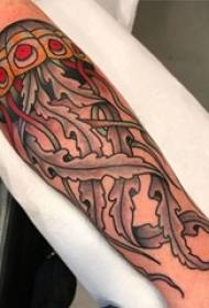 Aarm Tattoo Bild vun engem liewege Jellyfish Tattoo op engem Jong vum Aarm