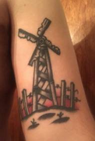 ແຂນຂອງເດັກນ້ອຍຜູ້ຊາຍທີ່ມີຮູບແຕ້ມລົມທີ່ສວຍງາມກ່ຽວກັບຮູບແຕ້ມ tattoo windmill ທີ່ມີສີສັນ