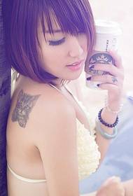 Sexy female model back cat cute tattoo pictures