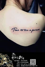 female shoulder back English tattoo