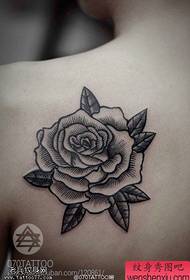 Back and black and white rose tattoos are shared by tattoos