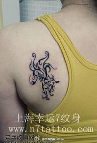 Girl's back nice looking totem fox tattoo pattern
