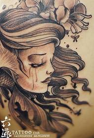 fliegender Fisch und traurige weinende Frau Tattoo-Muster