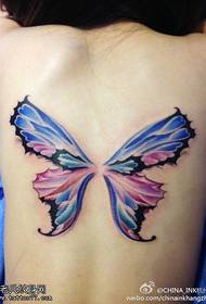 Женска татуировка на цвят на гърба на жената, споделена от залата за татуировки