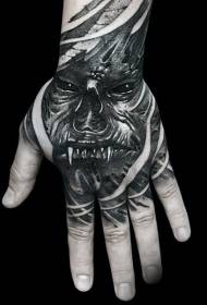 Mtindo wa kutisha mweusi uso wa tattoo nyuma