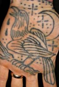 Håndgrædende fugl med tatoveringsmønster for måne og stjerner