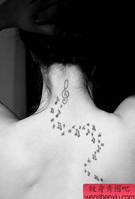 Girl's back nice looking note tattoo pattern