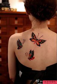 Woman back butterfly tattoo work