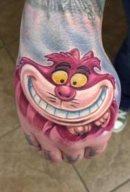 Забавная мультяшная улыбка Чеширского кота с татуировкой на тыльной стороне ладони
