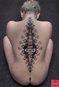 Woman creative back tattoo work