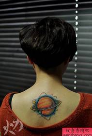 Beautiful colored Saturn tattoo pattern on the back of the girl