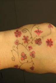 Ručni mali uzorak cvijeta tetovaže sa svježim bojom