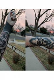 Snake tattoo boy hand ula honu kiʻi