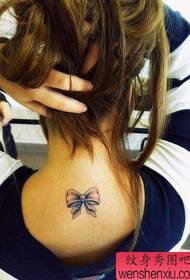 Small fresh back bow tattoos