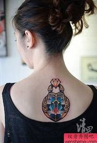 A beautiful diamond lock tattoo pattern popular on the back of girls