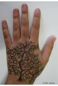 Դարչնագույն ծառի և կանաչ տերևի ձեռքի հետ, դաջվածքների օրինակին