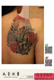 The popular classic hourglass and skull tattoo pattern on the back of girls