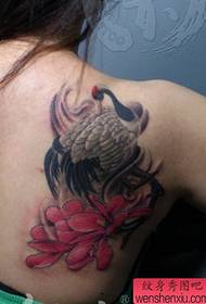 Girl's shoulder, a white crane tattoo pattern