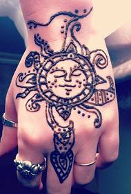 Beautiful sun totem tattoo on the back of the hand