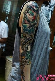 ຮູບພາບ tattoo ຄົນອັບເດດ: ແຂນ clown ດອກທີ່ສ້າງສັນ