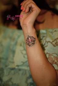 Small fresh crown wrist tattoo picture
