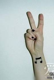 Darbojas mazs, svaigas rokas mūzikas simbola tetovējums