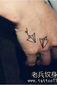 Hand small fresh paper crane tattoo works