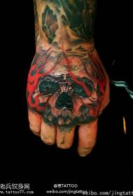 Tatuatge enfadat, espantós i crani