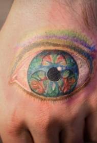 Padrão de tatuagem de olho de deus multicolorido na parte de trás da mão