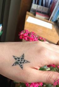 Cute starfish tattoo picture on hand