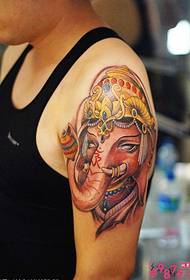 Braccio grosso come Dio ricco come immagine di un tatuaggio