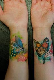 Vackra ser färgglada fjärils tatuering mönster bild på handleden
