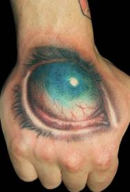 Furchtsames blaues Tätowierungsmuster der großen Augen auf dem Handrücken