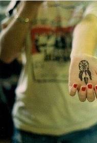 una imatge de tatuatge de palmera a mà