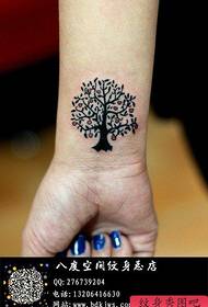 Girl's wrist small and delicate small tree tattoo pattern