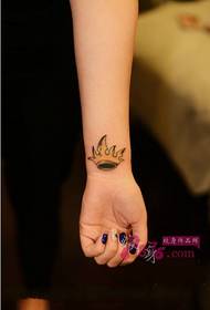 Small fresh crown wrist tattoo picture