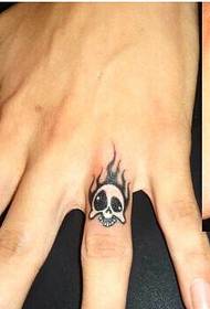 Boy hand pinky taro tattoo picture