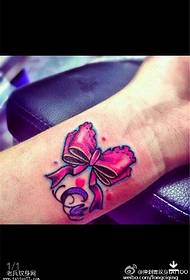 Foto tatuaggio arco color polso