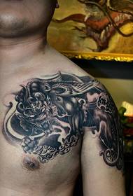 Domineering black and white half armor tattoo