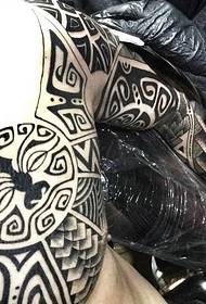 Cool and handsome Mayan half armor tattoo