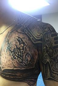 Passionatu di domini di meza durata di u tatuu totem