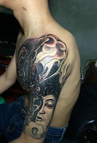 The domineering half armor tattoo picture combining cow demon and Buddha magic