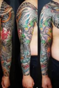 Tatuaj brat colorat cu jumatate de piele in stil traditional