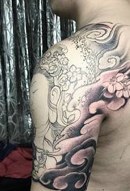 Half-arm tattoo tattoo gecombineerd met inktvis en Boeddha